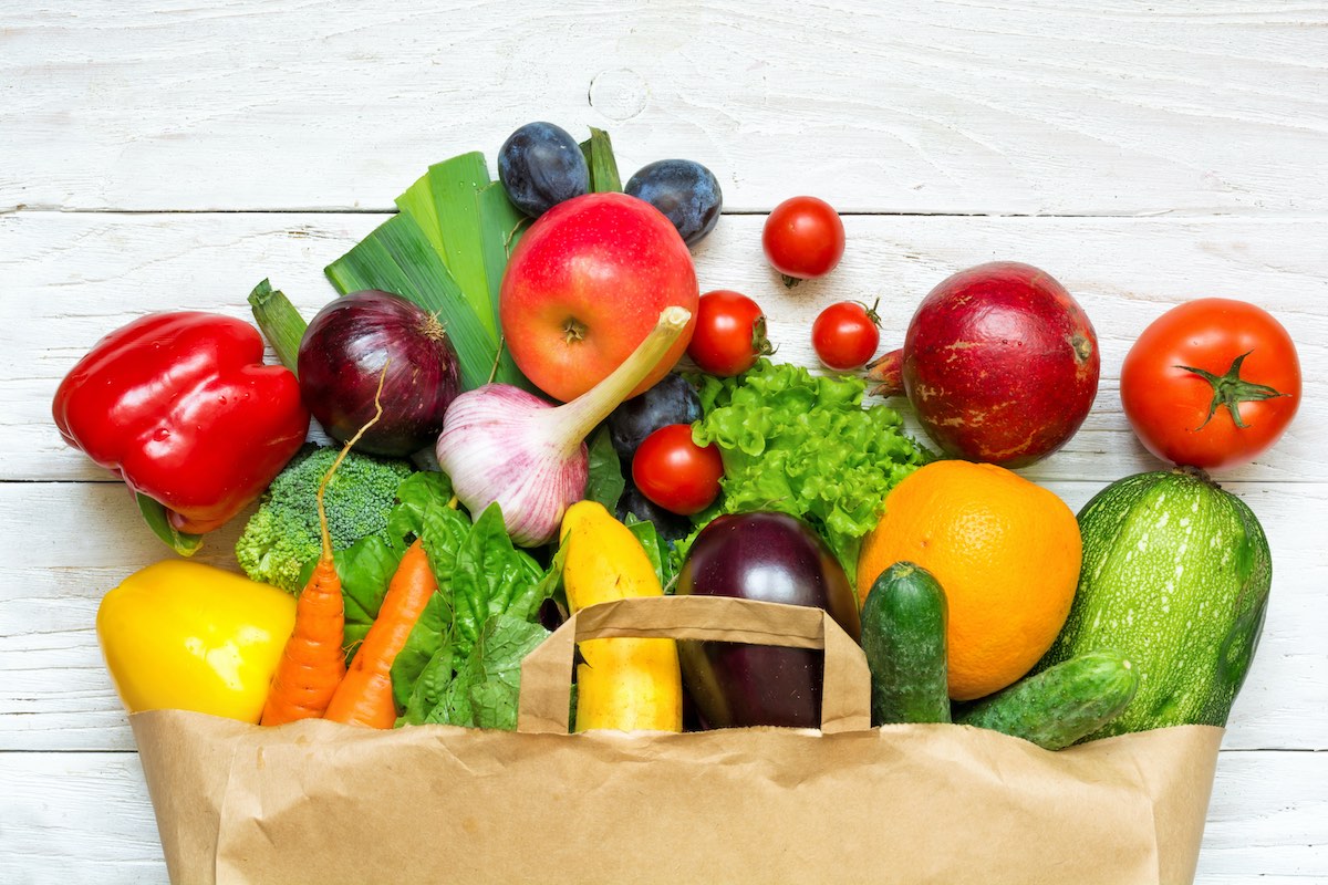 Grocery bag of fruits and vegetables to boost fertility